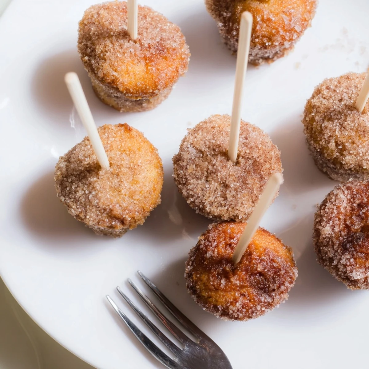 Warm muffin pops dusted in cinnamon sugar, bursting with maple and ginger flavors.