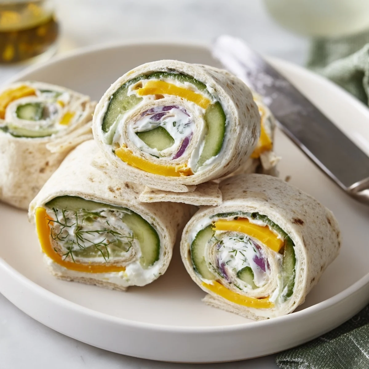 Crispy pickle-in-a-blanket bites, drizzled with mustard, perfect for snacking joy.