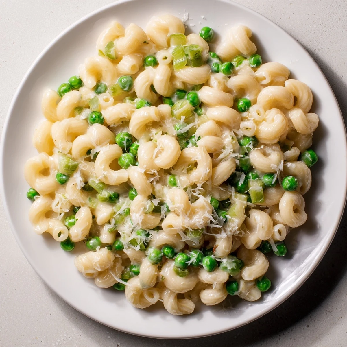Bright green peas nestle within the cheesy Macaroni & Peas, perfect for a quick dinner.