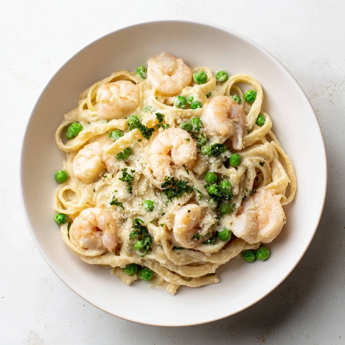 Steaming bowl of Instant Pot Shrimp Alfredo Pasta, showcasing tender shrimp in a rich, cheesy sauce.