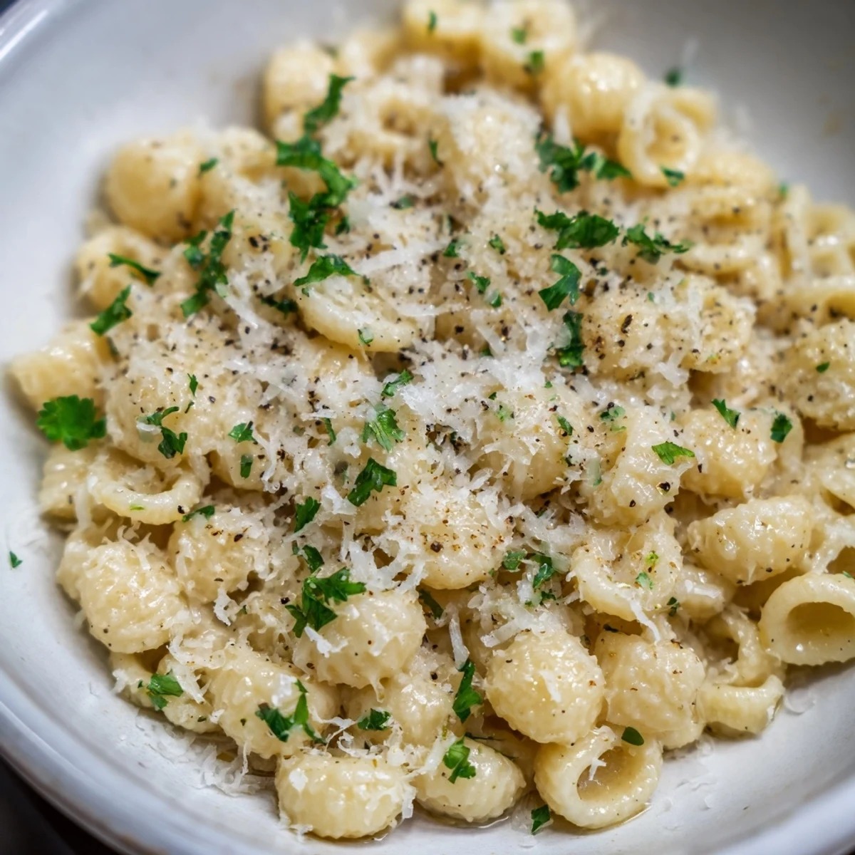 Steaming bowl of 15-Minute Garlic Parmesan Pasta, creamy and golden, ready to be enjoyed.