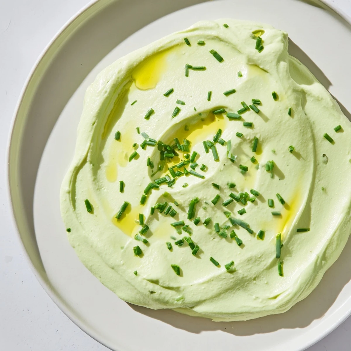 Creamy Avocado Cottage Cheese Dip, a vibrant green dip ready to be paired with fresh vegetables.