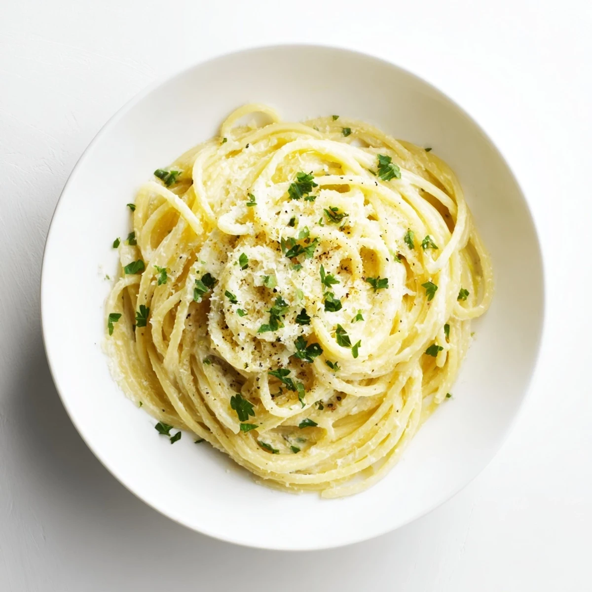 Savory Lemon Ricotta Pasta served hot, topped with grated Parmesan and cracked pepper, paired with a glass of crisp white wine.