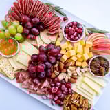 This Sleigh Ride Charcuterie features an array of cured meats and artisan cheeses, perfect for holiday entertaining.
