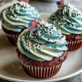 Festive Star-Spangled Banner Cupcakes topped with edible flags, ready for celebration.