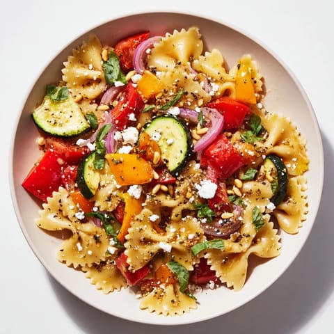 A beautiful photo of the delicious Festive Bow Tie Pasta Platter, ready to serve with lemon dressing.