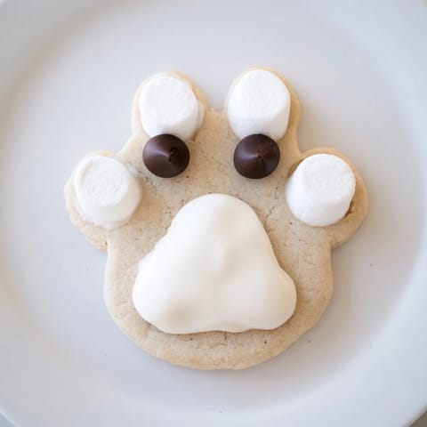 These charming Polar Bear Paw Print Cookies look irresistibly cute, ready to enjoy with a glass of milk.