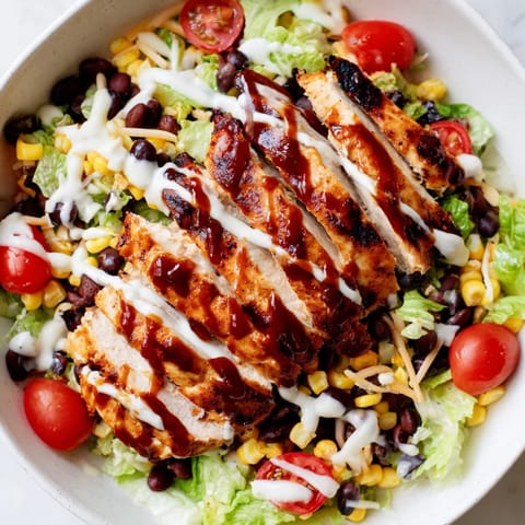 This BBQ Chicken Salad features juicy chicken, colorful veggies, and fresh cilantro-lime ranch, perfect for a quick, satisfying lunch or dinner.