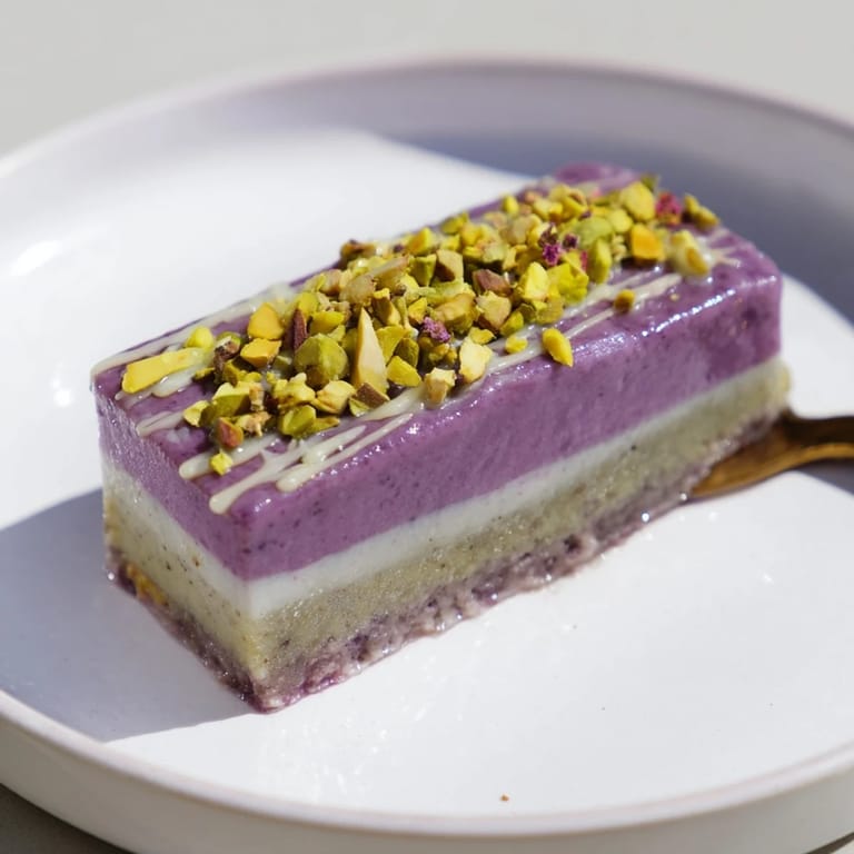Layered ube and pistachio ice cream bars, perfect for hot days or gatherings.