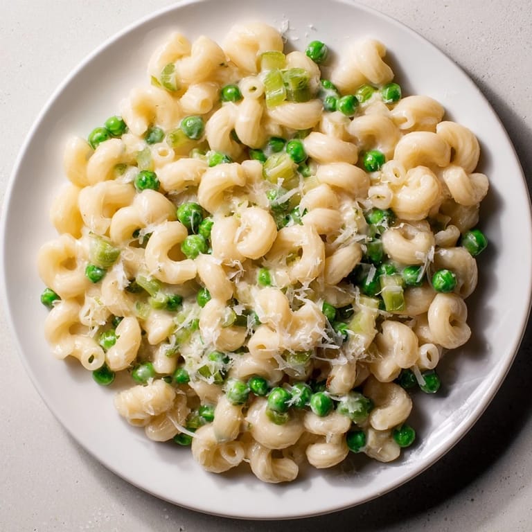 Bright green peas nestle within the cheesy Macaroni & Peas, perfect for a quick dinner.